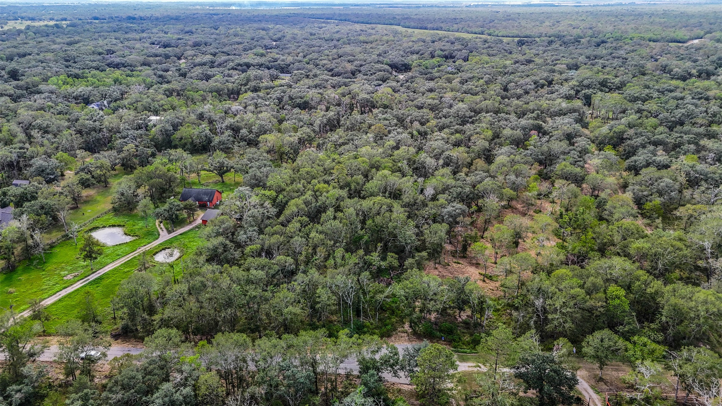 0 Live Oak Street Damon, TX 77430 - Photo 25 of 28 an aerial view of a house with a yard