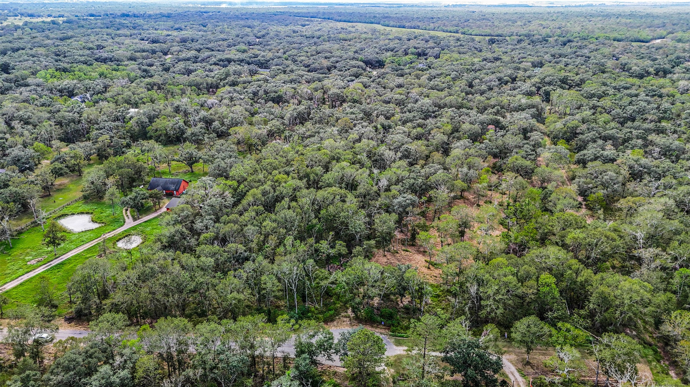 0 Live Oak Street Damon, TX 77430 - Photo 26 of 28 an aerial view of house with yard and outdoor seating