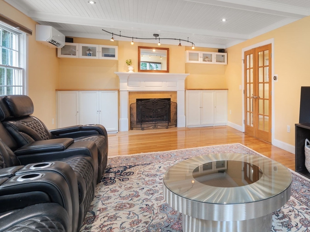 24 Russett Hill Road Sherborn, MA 01770 - Photo 15 of 39 a living room with furniture and a fireplace