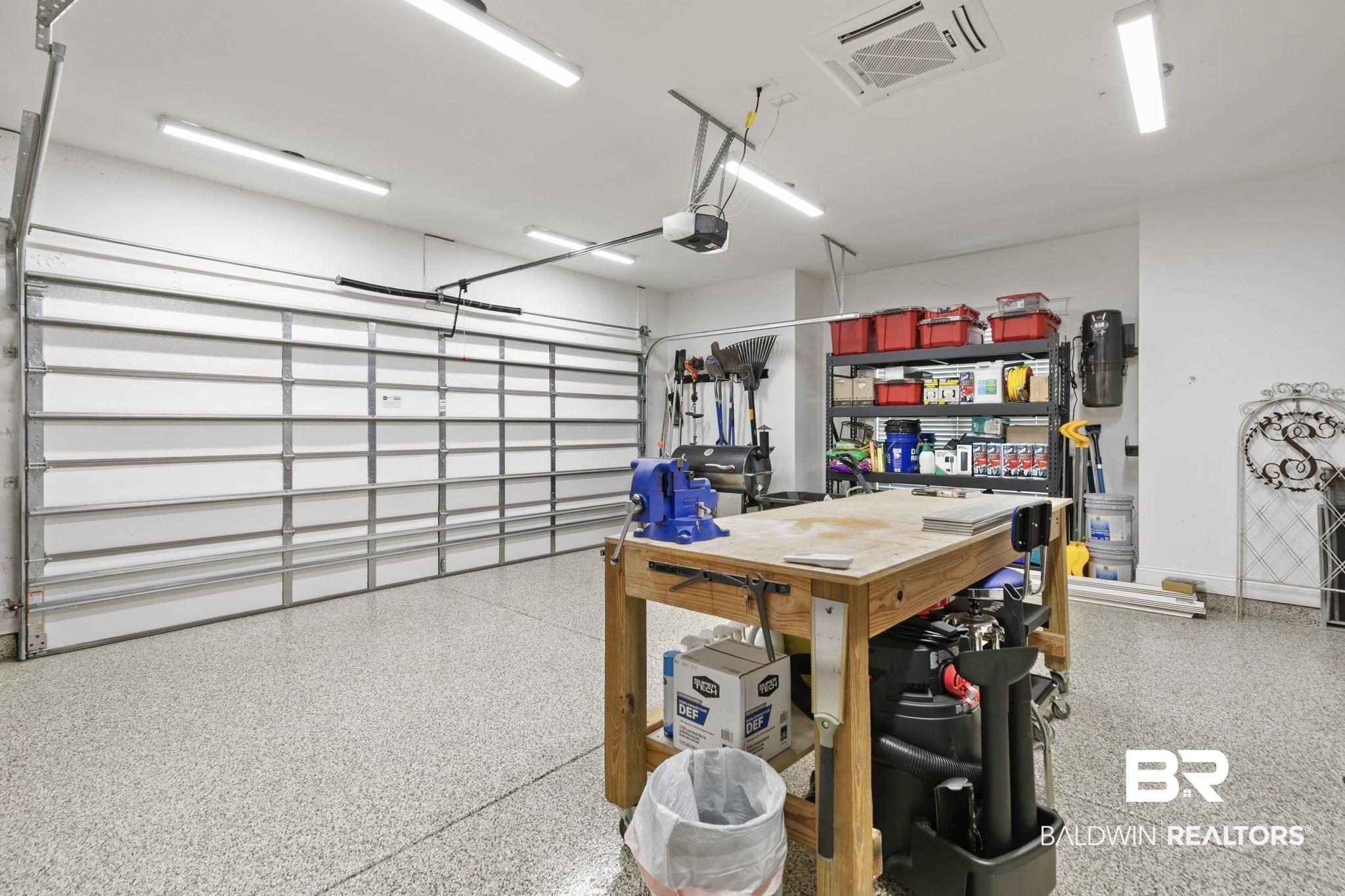 291 Hemlock Drive Fairhope, AL 36532 - Photo 57 of 65 Garage featuring a workshop area and a garage door opener