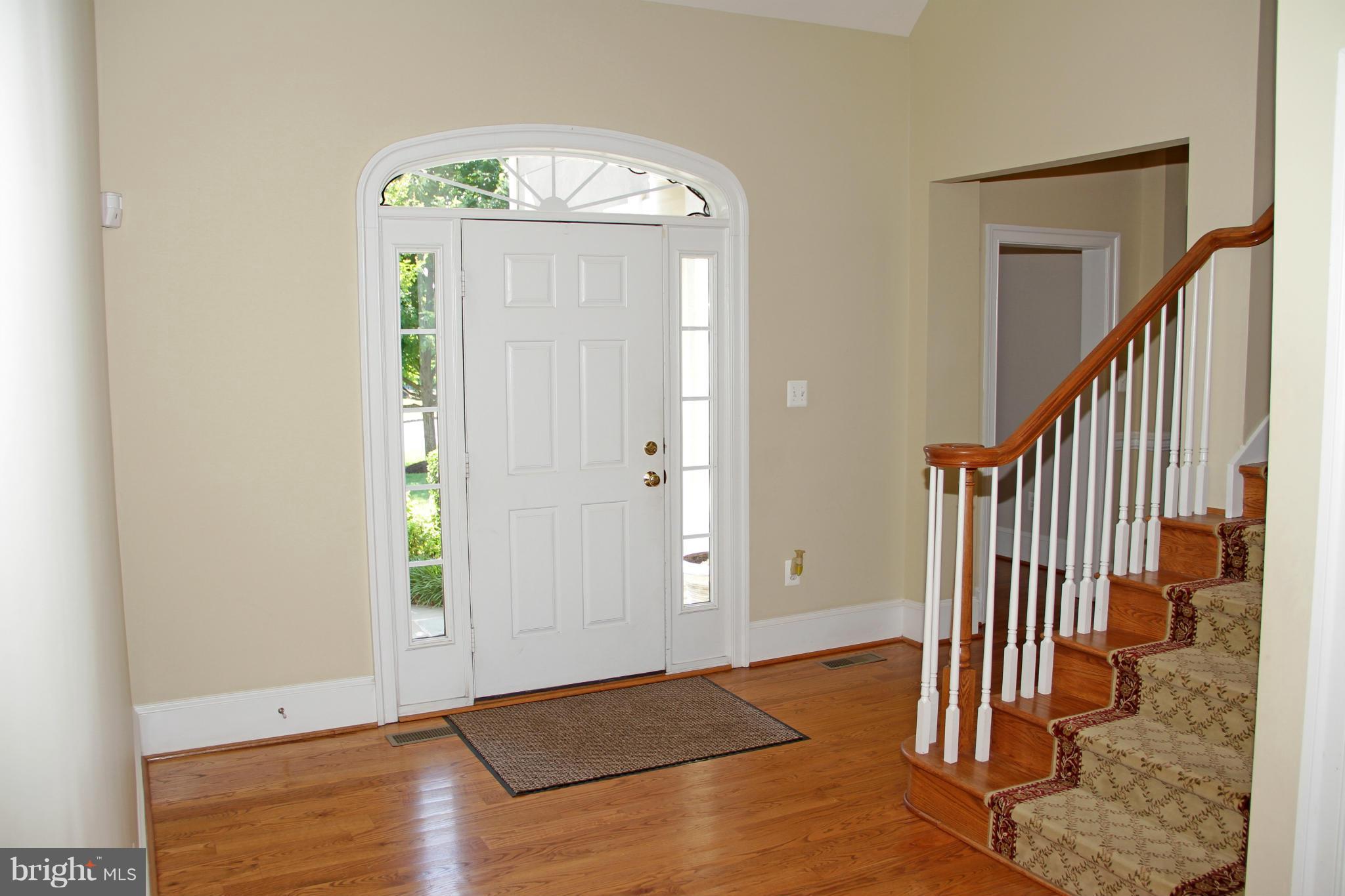 8288 Roxborough Loop Gainesville, VA 20155 - Photo 2 of 30 Foyer with Vaulted Ceiling