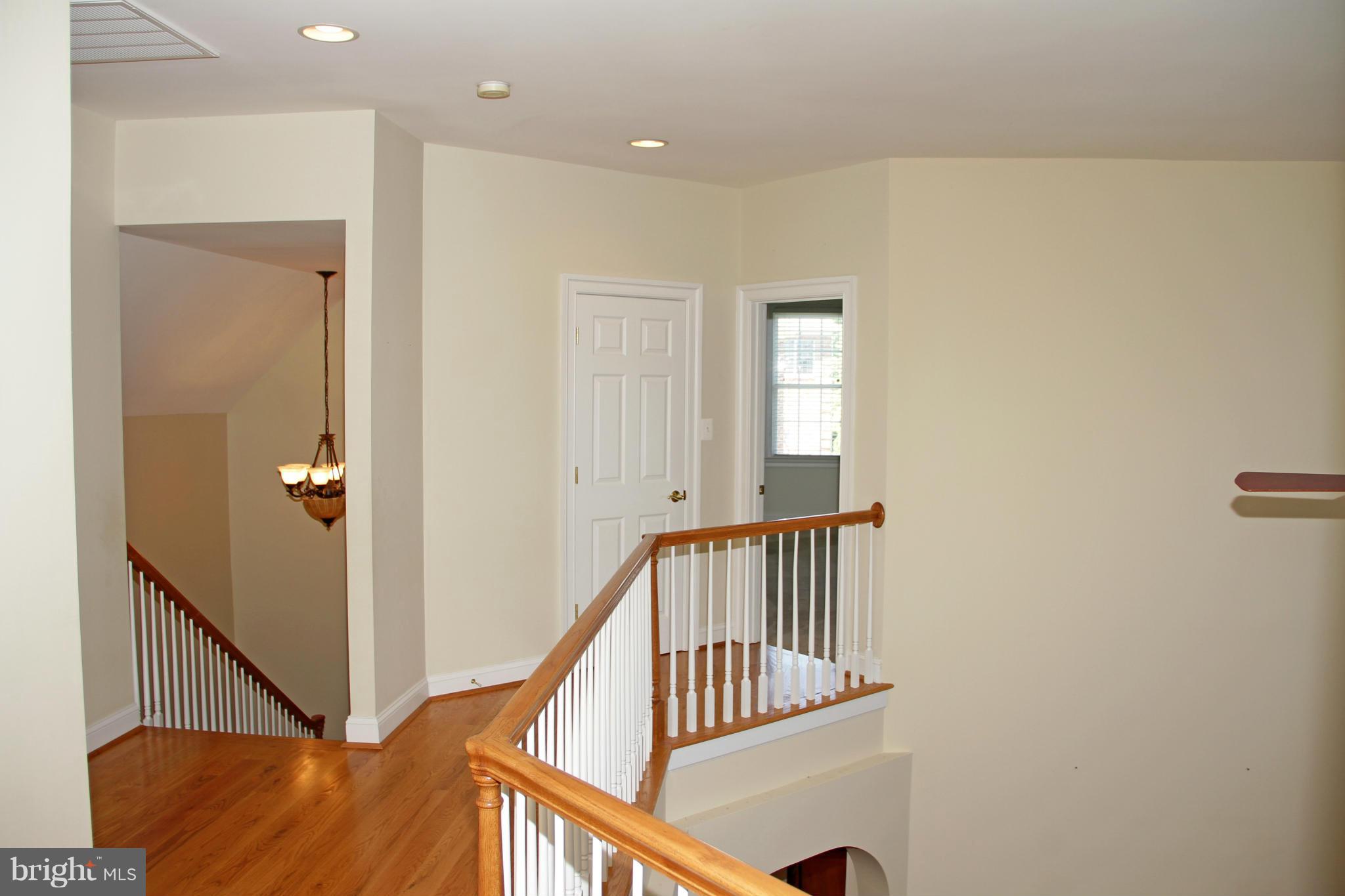 8288 Roxborough Loop Gainesville, VA 20155 - Photo 20 of 30 Upper Level Landing with Overlook to Family Room