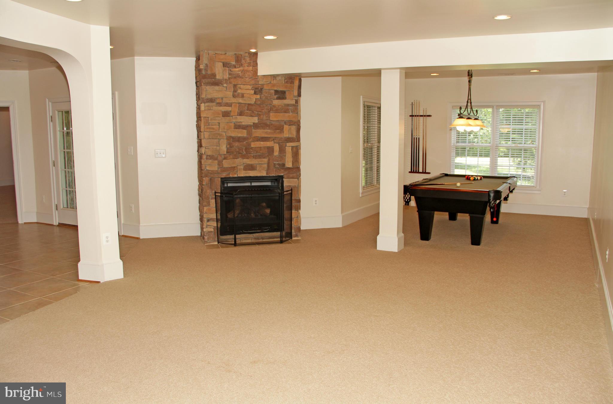 8288 Roxborough Loop Gainesville, VA 20155 - Photo 24 of 30 Large Rec Room with Stone Fireplace