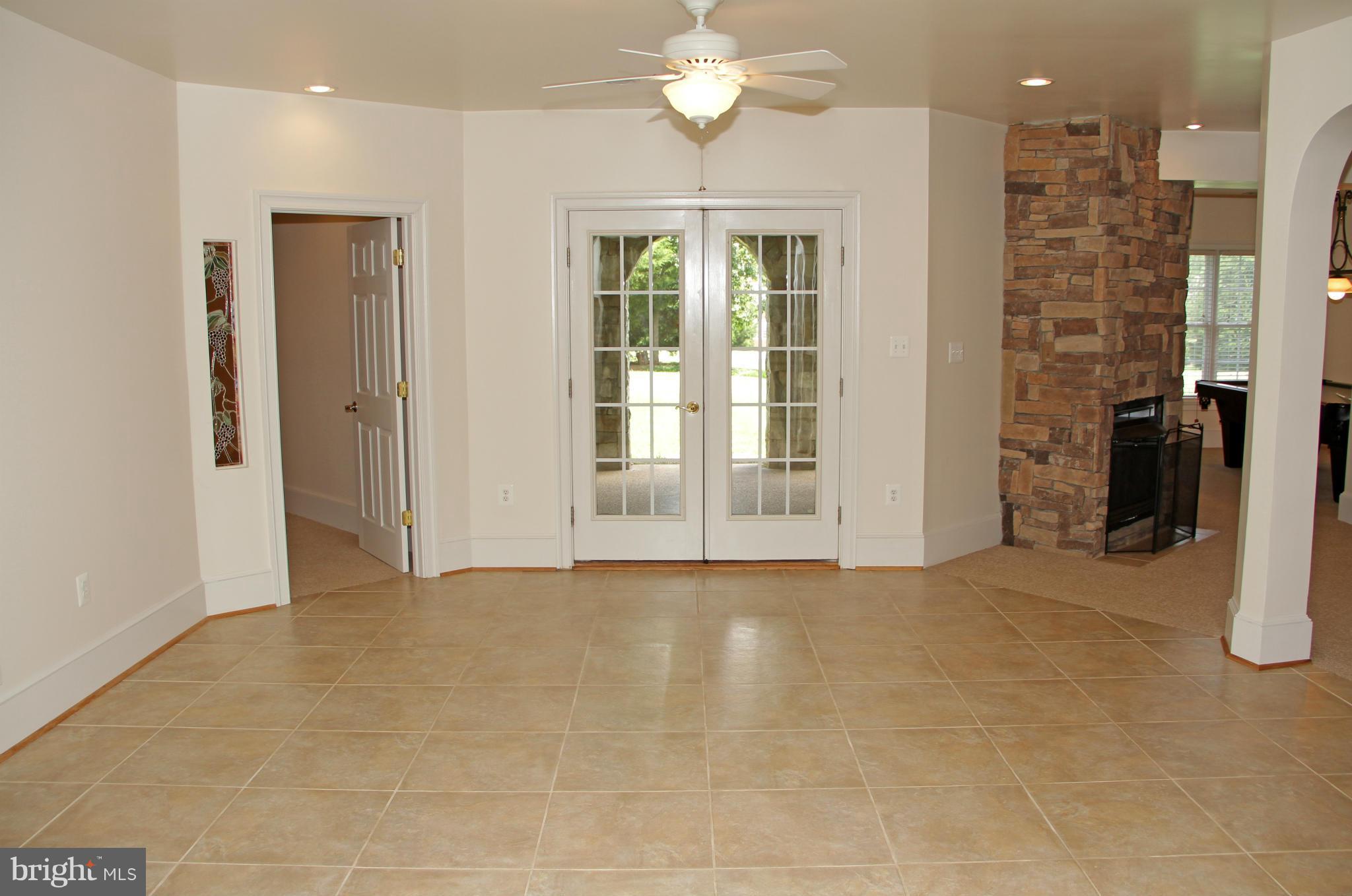 8288 Roxborough Loop Gainesville, VA 20155 - Photo 26 of 30 Central Tiled Area with French Doors to Lanai