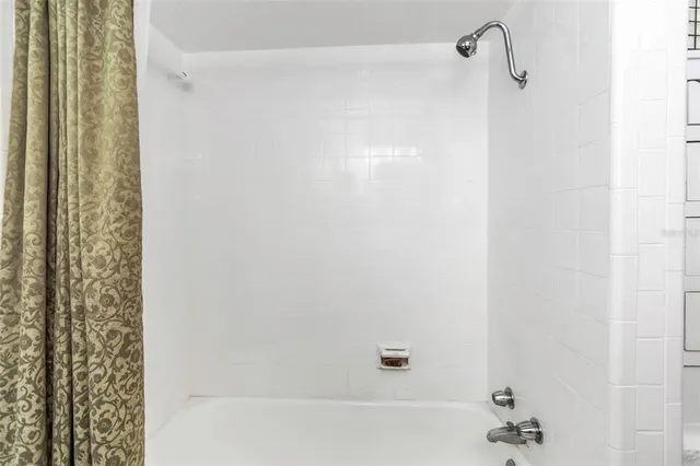 a bathroom with a sink mirror toilet and next to a window