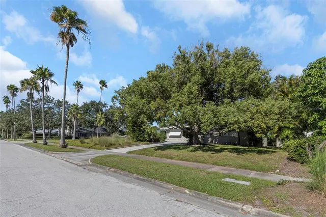 an aerial view of a house with a garden and plants