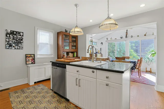a kitchen with sink and cabinets