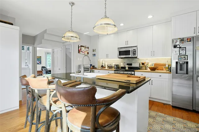 a kitchen with a dining table and chairs