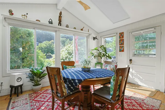 a view of a dining room with furniture window and outside view