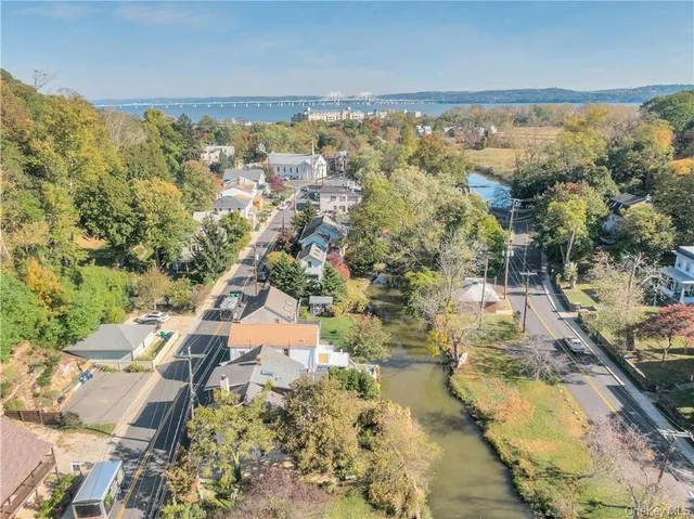 an aerial view of residential houses with outdoor space
