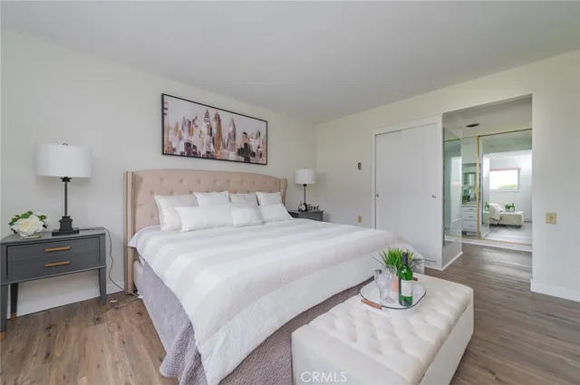 a bedroom with bed and a table