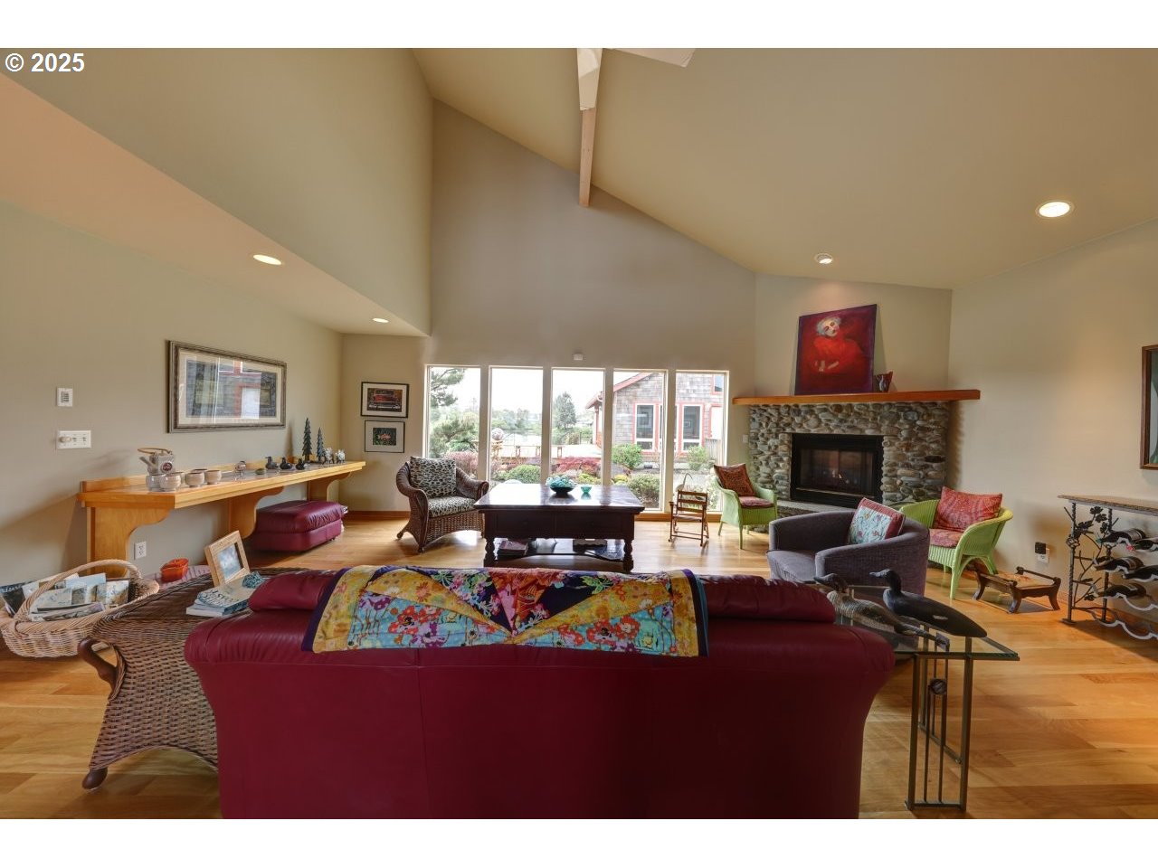 500 Farrell Court Seaside, OR 97138 - Photo 12 of 39 a living room with furniture fireplace and a large window