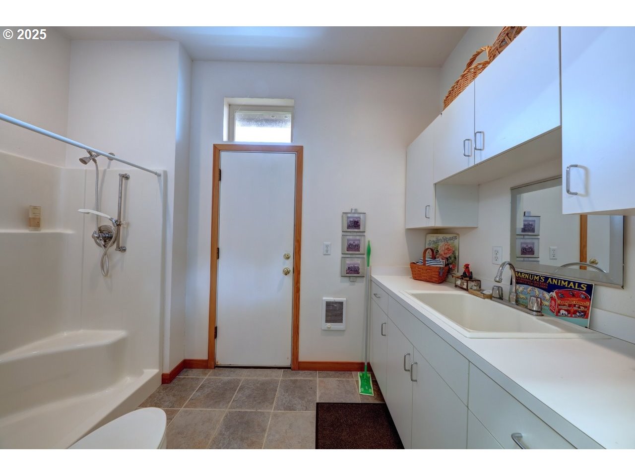 500 Farrell Court Seaside, OR 97138 - Photo 14 of 39 a kitchen with a sink a refrigerator and cabinets