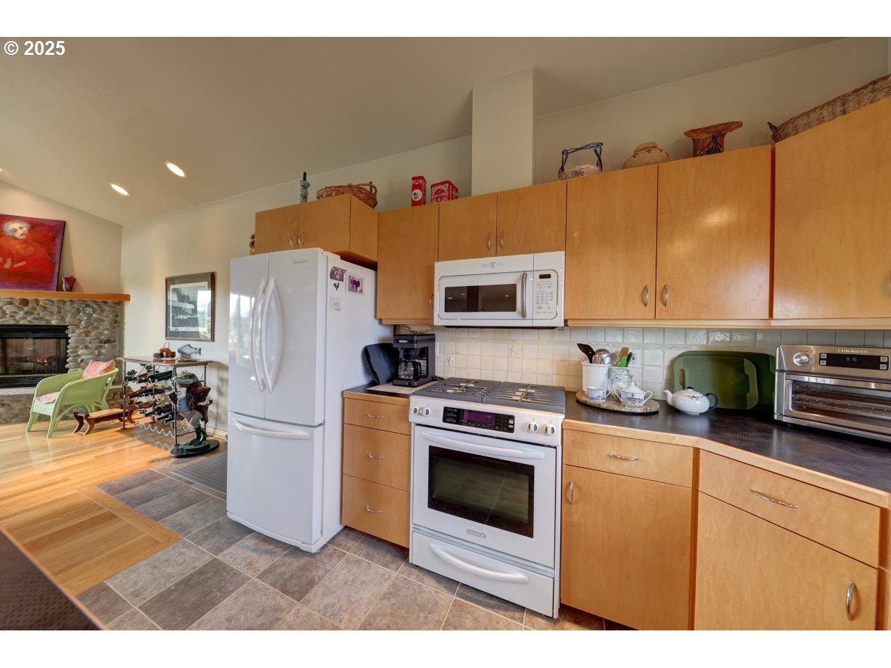 500 Farrell Court Seaside, OR 97138 - Photo 15 of 39 a kitchen with stainless steel appliances a stove a refrigerator a sink a stove top oven