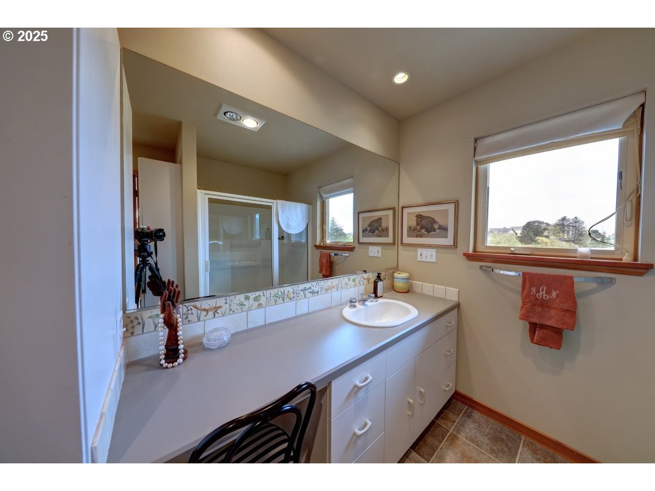 500 Farrell Court Seaside, OR 97138 - Photo 20 of 39 a bathroom with a double vanity sink and a mirror