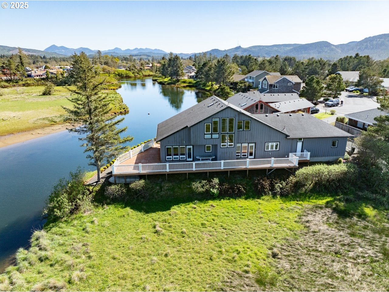 500 Farrell Court Seaside, OR 97138 - Photo 2 of 39 a front view of a house with a garden