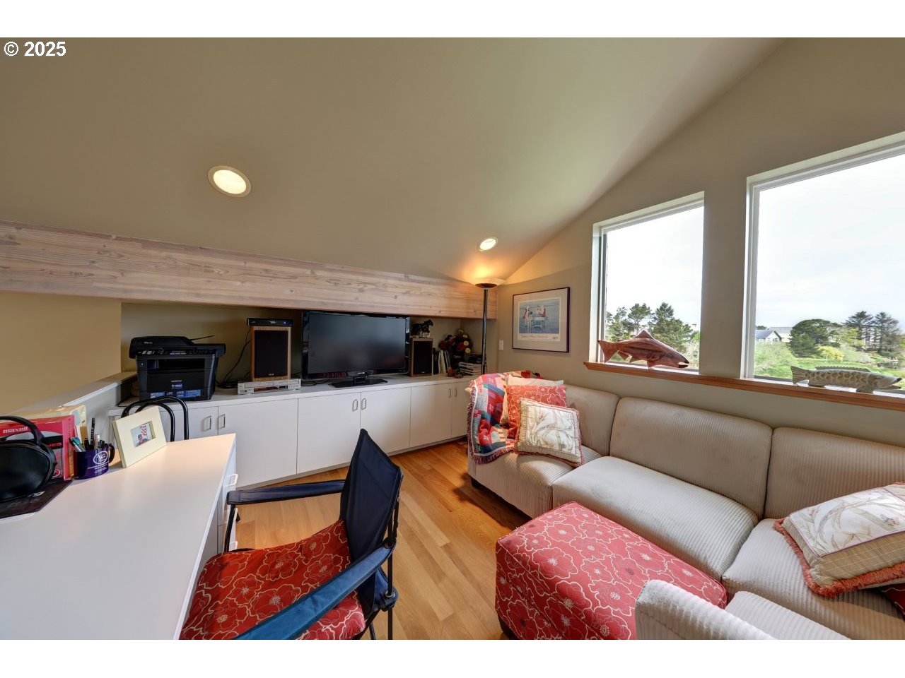 500 Farrell Court Seaside, OR 97138 - Photo 27 of 39 a living room with furniture and a flat screen tv