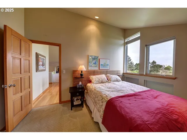 a bed room with a bed and a large window