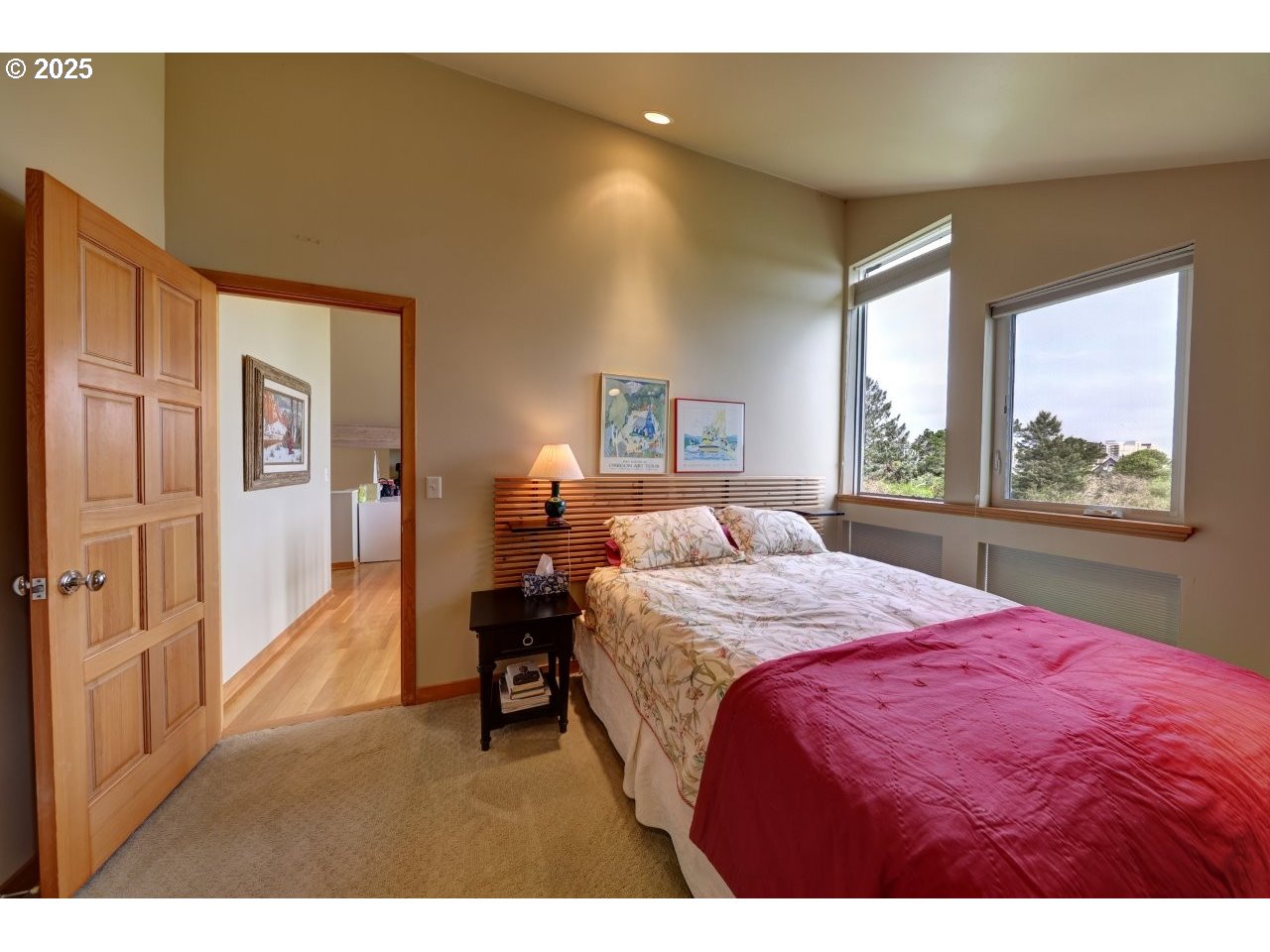 500 Farrell Court Seaside, OR 97138 - Photo 35 of 39 a bed room with a bed and a large window