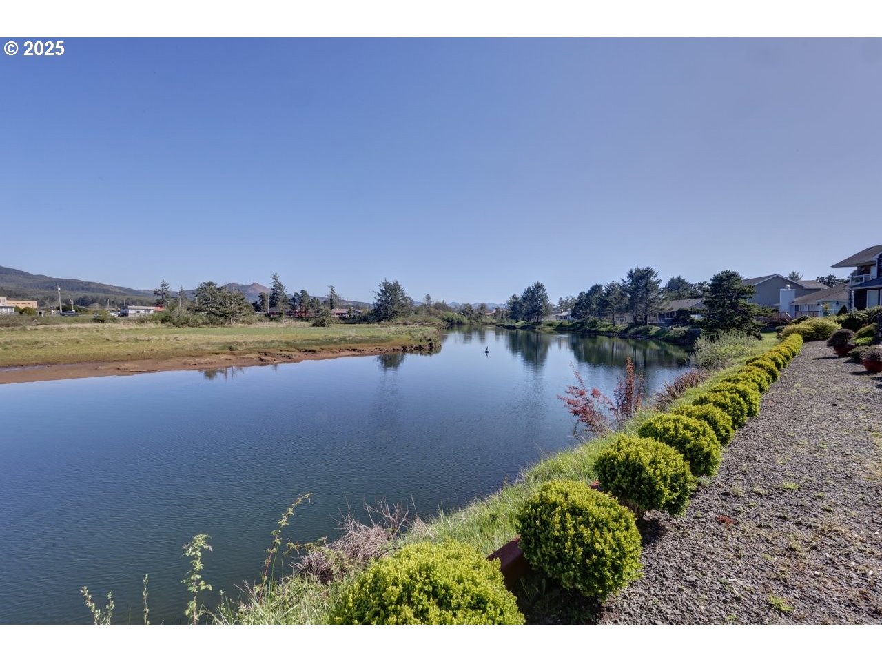 500 Farrell Court Seaside, OR 97138 - Photo 38 of 39 a view of a lake with houses in the back