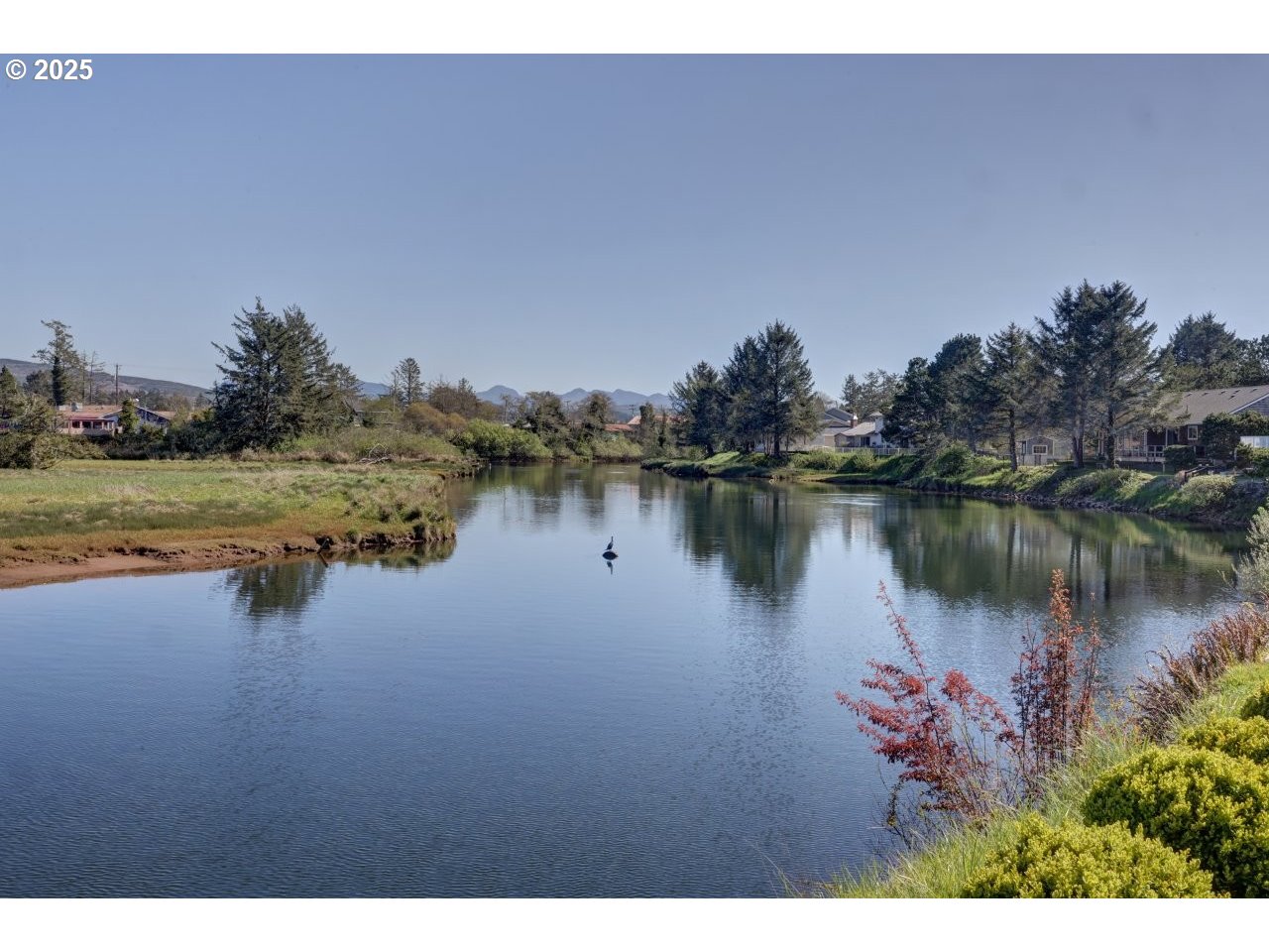500 Farrell Court Seaside, OR 97138 - Photo 39 of 39 a view of a lake with houses in the back