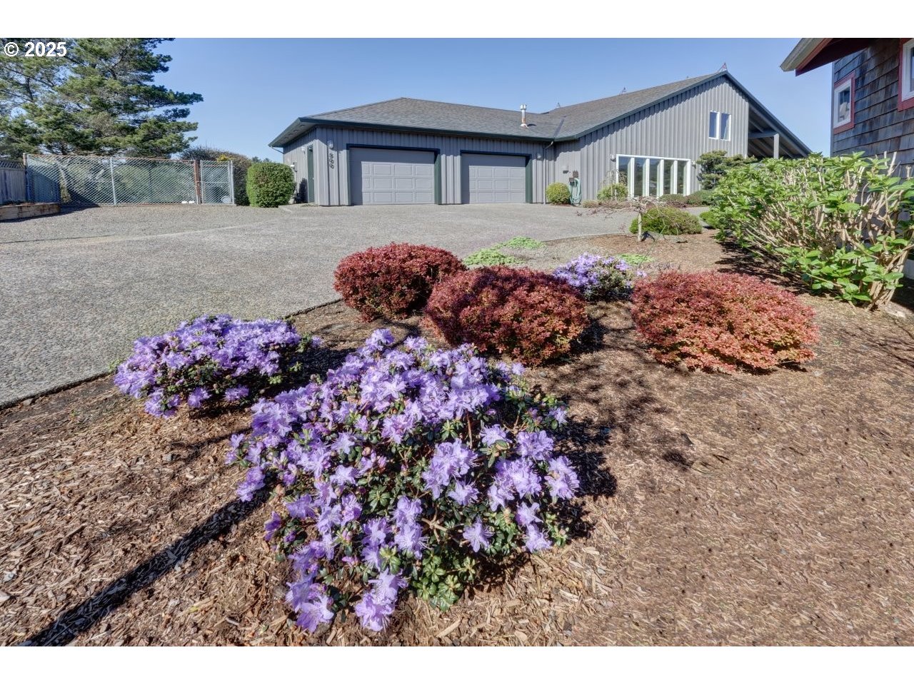 500 Farrell Court Seaside, OR 97138 - Photo 5 of 39 a front view of a house with a yard