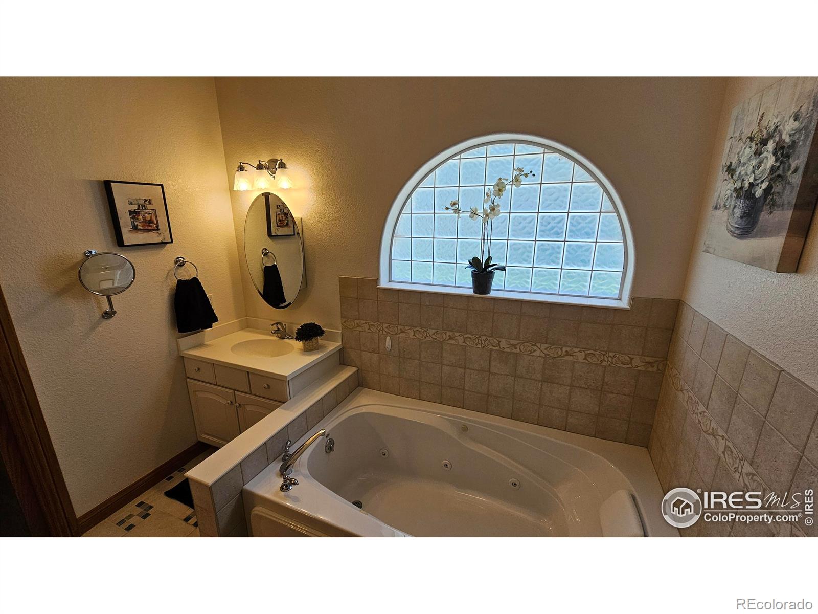 17606 County Rd Q.8 Fort Morgan, CO 80701 - Photo 14 of 37 a bathroom with a sink mirror and vanity