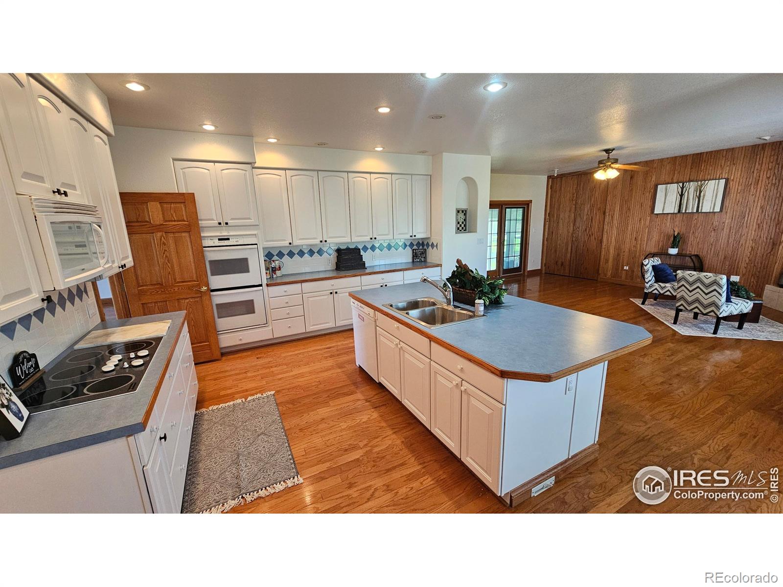 17606 County Rd Q.8 Fort Morgan, CO 80701 - Photo 20 of 37 a kitchen with stainless steel appliances granite countertop a sink stove and refrigerator