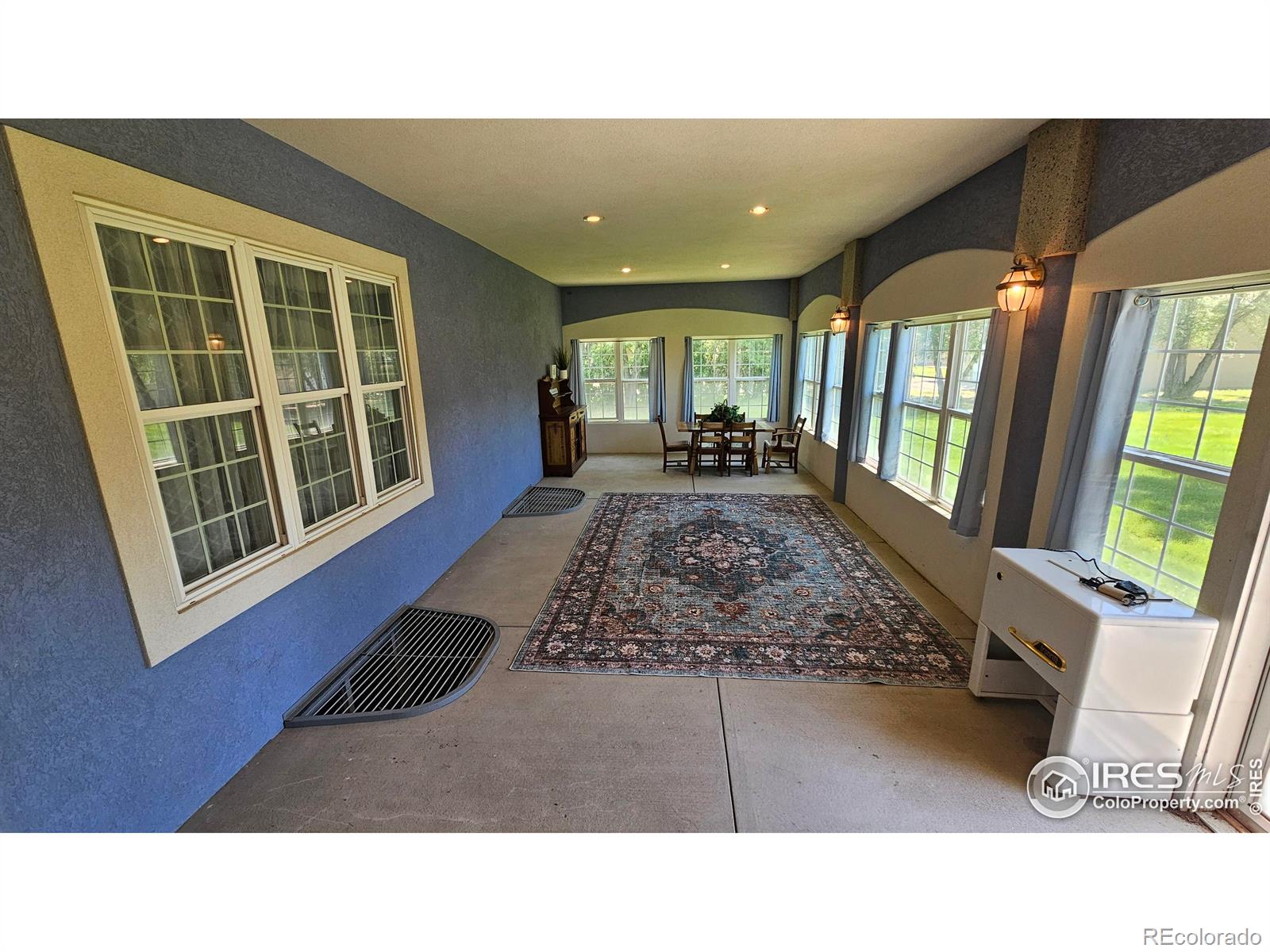 17606 County Rd Q.8 Fort Morgan, CO 80701 - Photo 25 of 37 a living room with a bed furniture and a large window