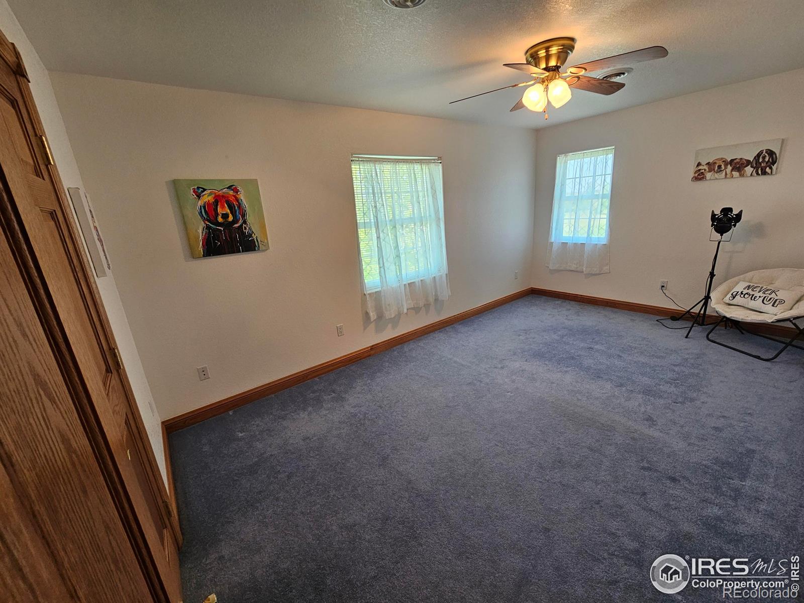 17606 County Rd Q.8 Fort Morgan, CO 80701 - Photo 26 of 37 an empty room with windows and ceiling fan
