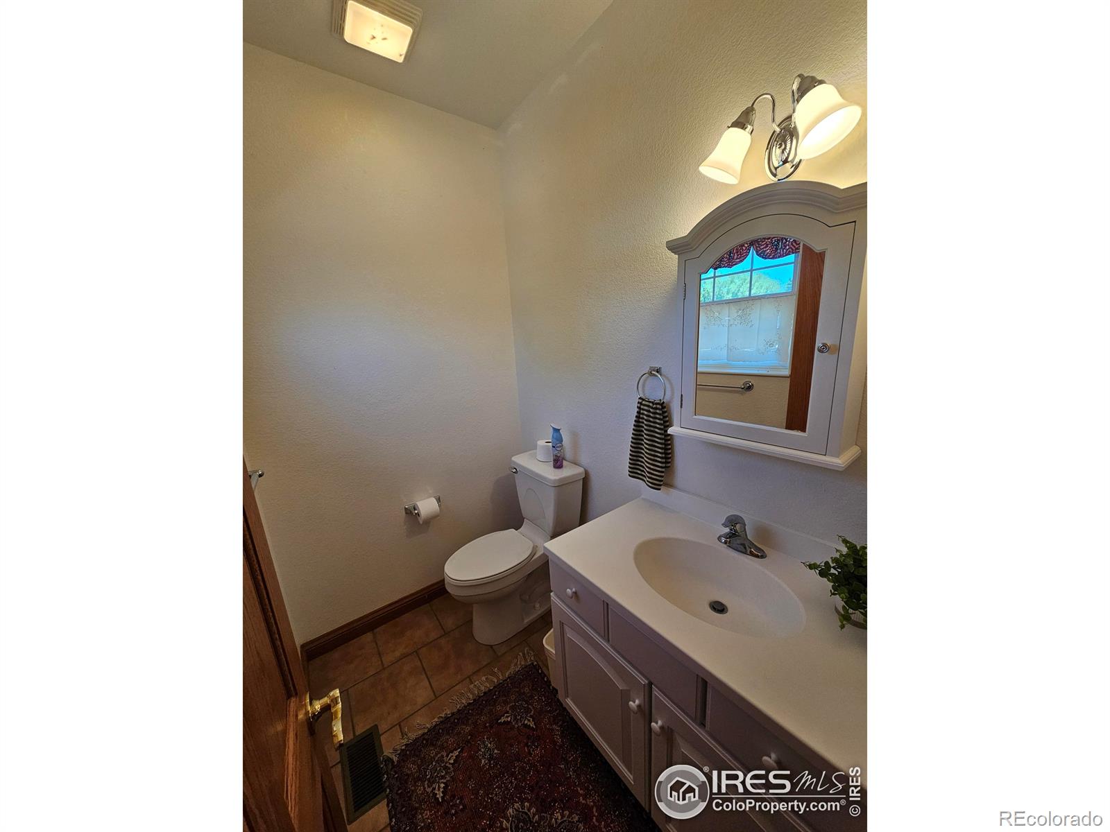 17606 County Rd Q.8 Fort Morgan, CO 80701 - Photo 35 of 37 a bathroom with a sink and a toilet