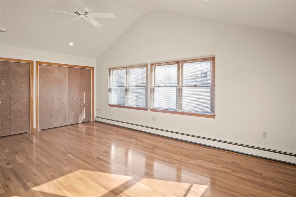 8 Grace Road Woburn, MA 01801 - Photo 13 of 37 an empty room with wooden floor and windows