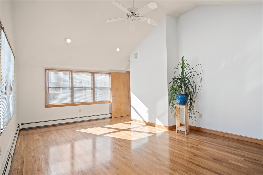 8 Grace Road Woburn, MA 01801 - Photo 14 of 37 an empty room with wooden floor and windows