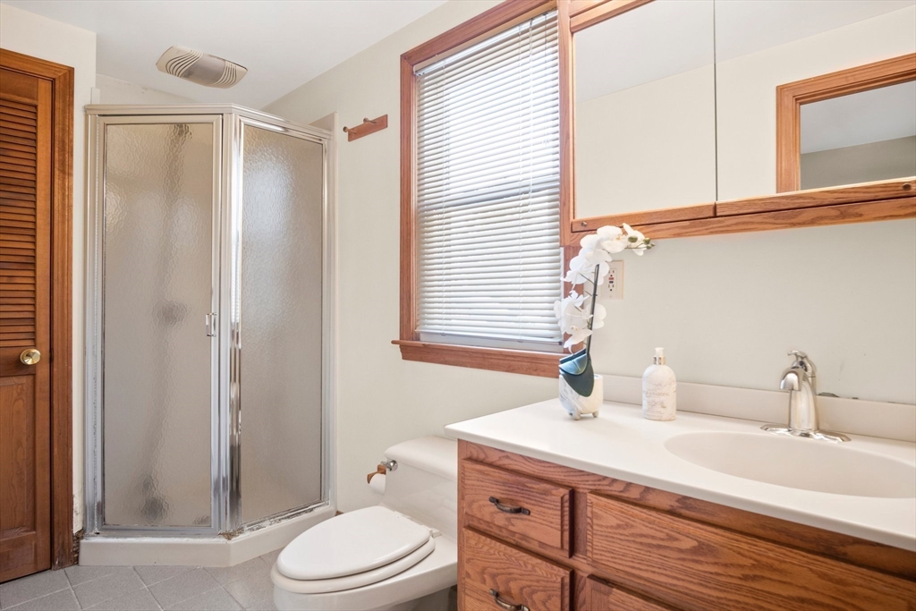 8 Grace Road Woburn, MA 01801 - Photo 20 of 37 a bathroom with a sink a toilet and shower