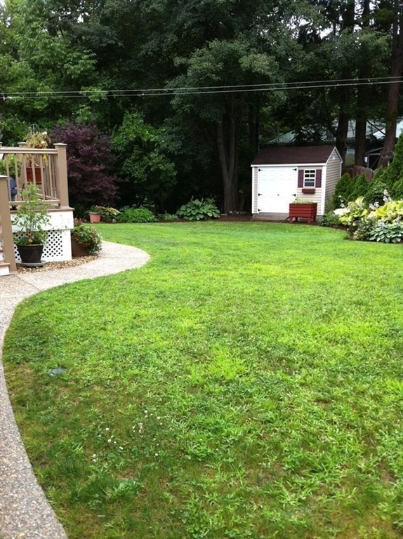 8 Grace Road Woburn, MA 01801 - Photo 24 of 37 a front view of a house with garden