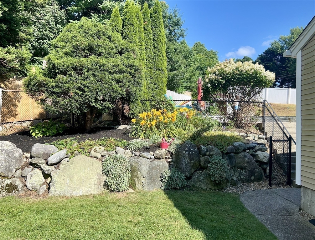 8 Grace Road Woburn, MA 01801 - Photo 25 of 37 a view of a garden with a fountain