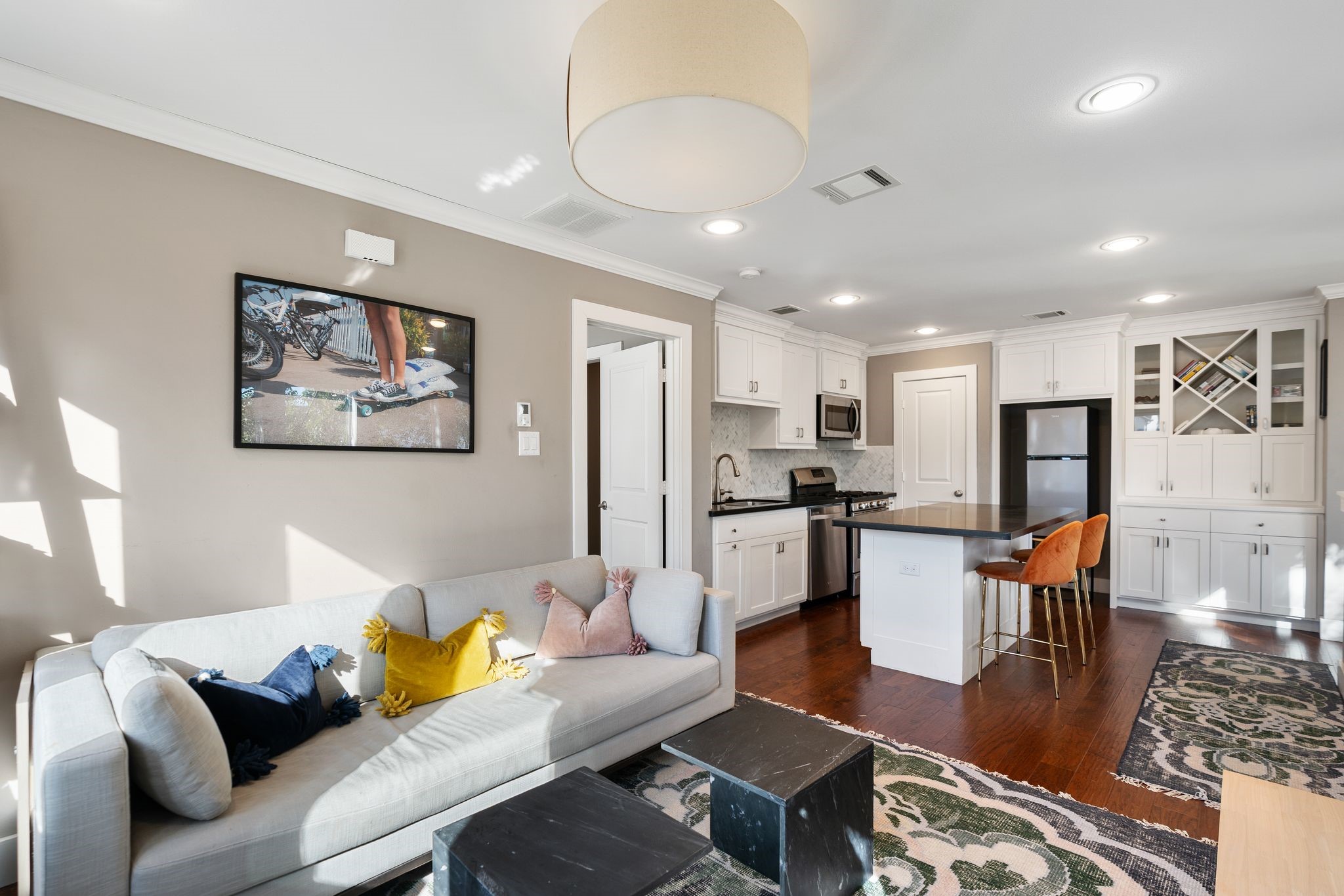 3914 Colquitt Street Houston, TX 77027 - Photo 24 of 36 From the living room you can see how seamlessly the space flows back into the kitchen and island seating. It keeps everything connected without feeling cramped.