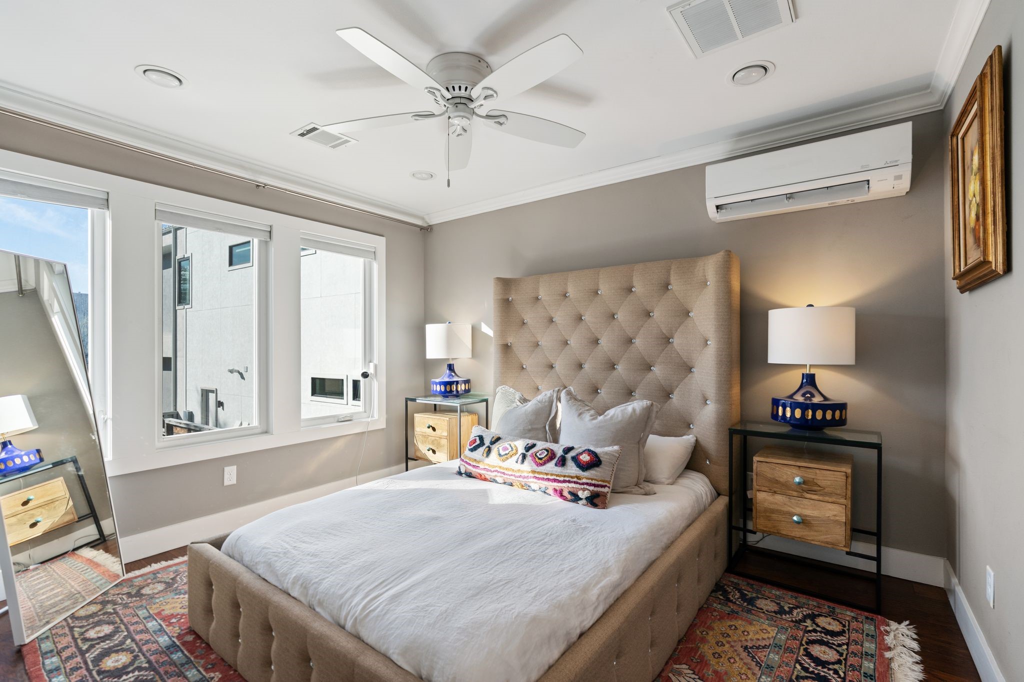 3914 Colquitt Street Houston, TX 77027 - Photo 25 of 36 The garage apartment bedroom offers a comfortable retreat with multiple windows and a ceiling fan. A newer mini split (2022)! This bedroom also enjoys a walk in closet with built in dresser.