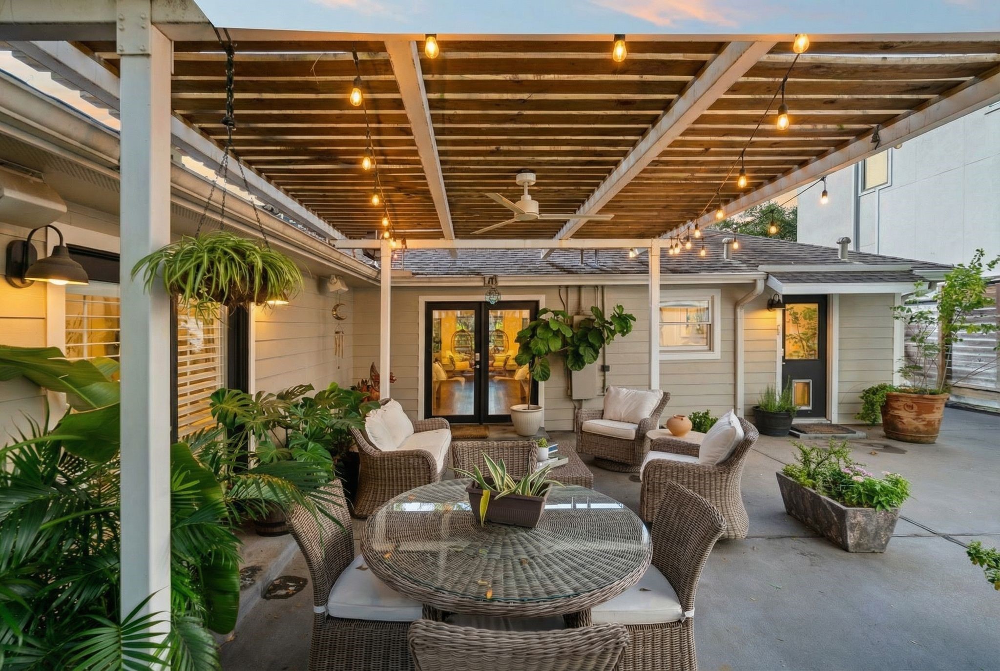 3914 Colquitt Street Houston, TX 77027 - Photo 31 of 36 Another evening perspective showcases the outdoor dining and seating areas under the pergola making it feel like a private courtyard.