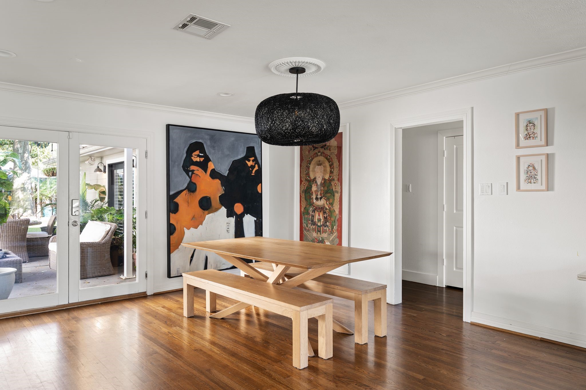 3914 Colquitt Street Houston, TX 77027 - Photo 6 of 36 The dining room is centrally located and feels open to the home's main living spaces. Double doors connect you to the backyard and outdoor living area for seamless indoor-outdoor flow.
