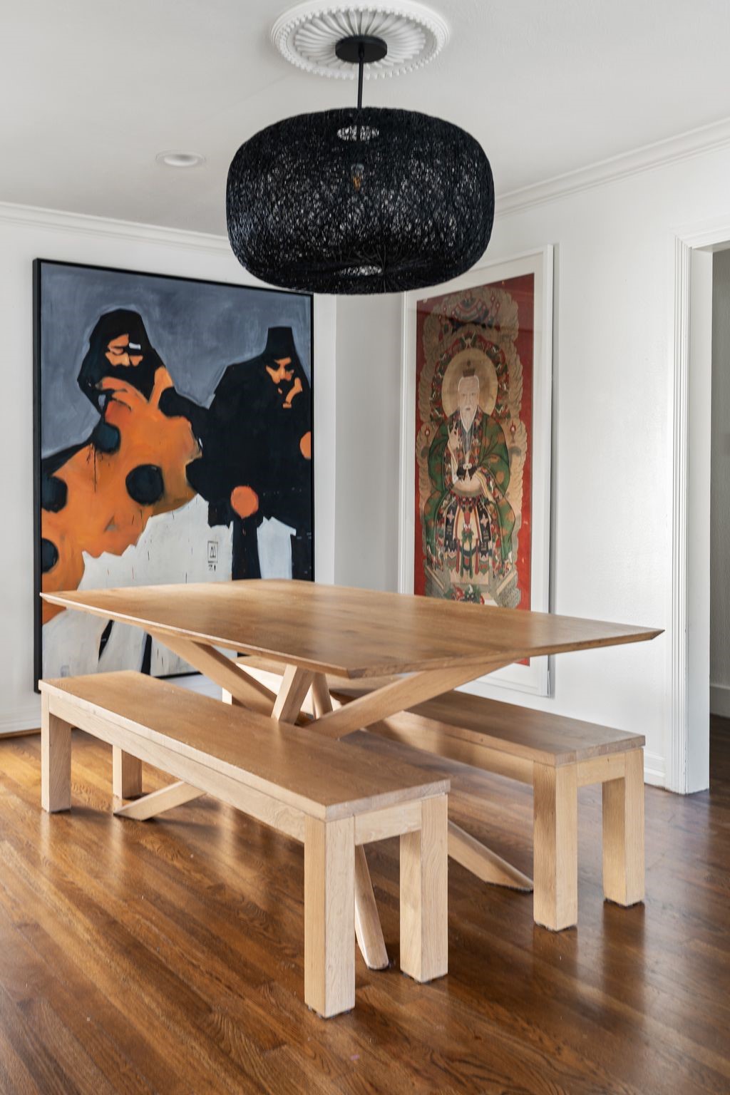 3914 Colquitt Street Houston, TX 77027 - Photo 7 of 36 The dining room features a statement light fixture with a decorative ceiling medallion and crown molding. The kitchen sits just to the left, creating an easy flow for everyday meals and entertaining.
