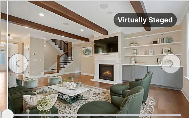 4105 Bellehurst Lane Cumming, GA 30040 - Photo 11 of 48 a living room with furniture a flat screen tv and a fireplace