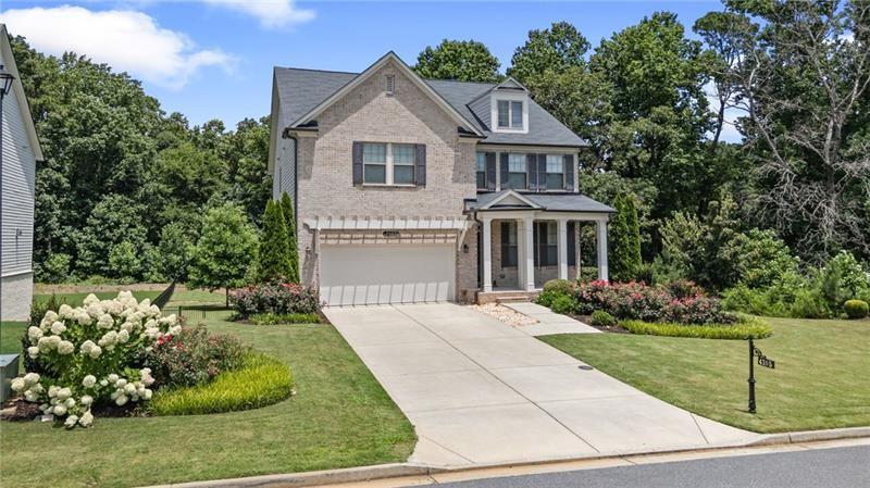 4105 Bellehurst Lane Cumming, GA 30040 - Photo 2 of 48 a front view of a house with a garden