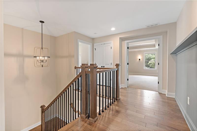 4105 Bellehurst Lane Cumming, GA 30040 - Photo 21 of 48 a view of a hallway with windows