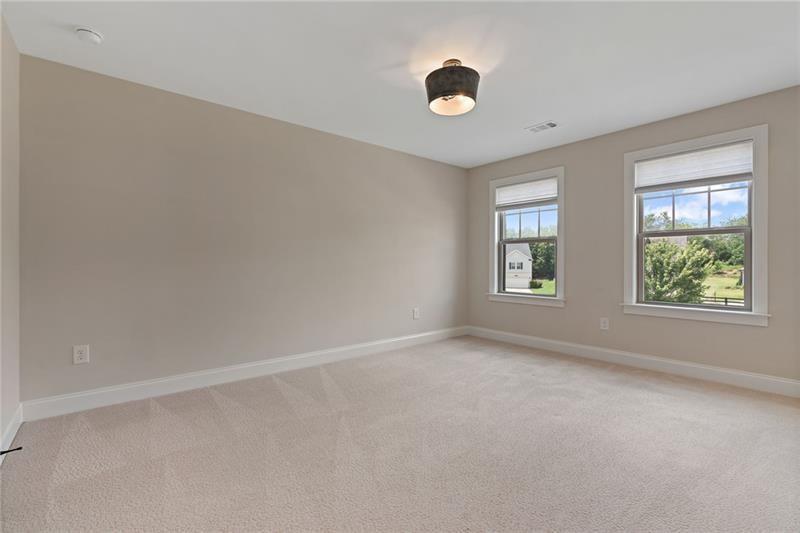 4105 Bellehurst Lane Cumming, GA 30040 - Photo 31 of 48 an empty room with windows