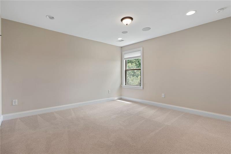 4105 Bellehurst Lane Cumming, GA 30040 - Photo 32 of 48 an empty room with windows and chandelier fan