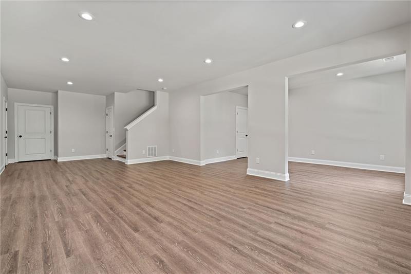 4105 Bellehurst Lane Cumming, GA 30040 - Photo 36 of 48 a view of empty room with wooden floor