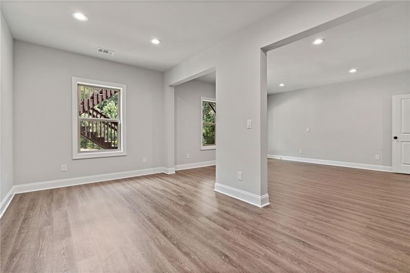 4105 Bellehurst Lane Cumming, GA 30040 - Photo 37 of 48 an empty room with wooden floor and windows