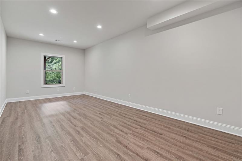 4105 Bellehurst Lane Cumming, GA 30040 - Photo 38 of 48 a view of empty room with wooden floor and fan