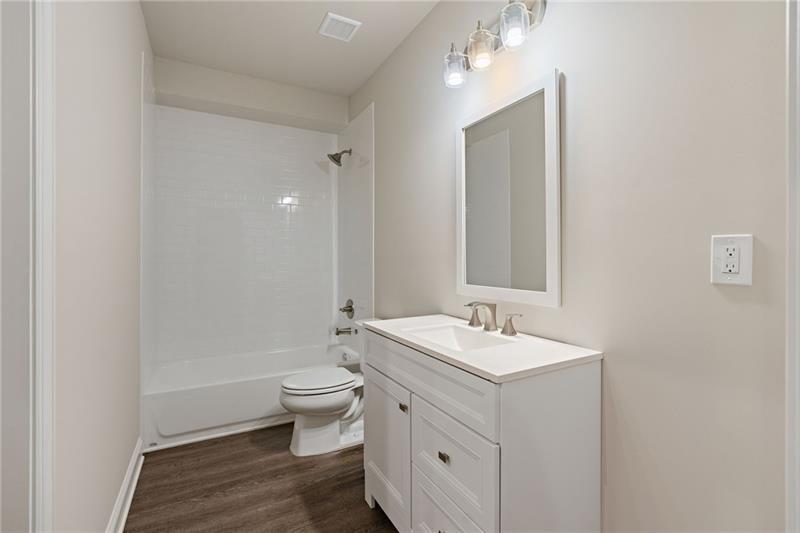 4105 Bellehurst Lane Cumming, GA 30040 - Photo 39 of 48 a bathroom with a sink and a mirror